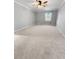 Spacious bedroom featuring neutral carpet, paint, ceiling fan, and natural light at 3260 Henderson Mill Rd # A, Atlanta, GA 30341