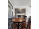 Dining area features hardwood floors and is adjacent to a modern kitchen with stainless steel appliances at 3260 Henderson Mill Rd # A, Atlanta, GA 30341