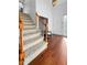 Bright entryway showcasing hardwood floors, a staircase, and a white front door at 3260 Henderson Mill Rd # A, Atlanta, GA 30341