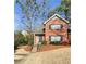 Charming brick townhouse with meticulously landscaped front yard and attractive front entry at 3260 Henderson Mill Rd # A, Atlanta, GA 30341