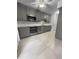 Kitchen featuring stainless steel appliances, gray cabinets, and tile flooring at 3260 Henderson Mill Rd # A, Atlanta, GA 30341