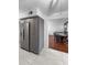 The kitchen features gray cabinets, tile floors, and stainless steel appliances at 3260 Henderson Mill Rd # A, Atlanta, GA 30341