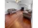Comfortable living room featuring hardwood floors, neutral walls, and stylish leather sofas at 3260 Henderson Mill Rd # A, Atlanta, GA 30341