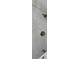 Shower with a handheld sprayer and tiled surround in gray marble design at 3260 Henderson Mill Rd # A, Atlanta, GA 30341