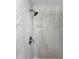 Shower with a handheld sprayer and tiled surround in gray marble design at 3260 Henderson Mill Rd # A, Atlanta, GA 30341