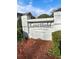 Elegant community signage amidst lush greenery enhances the upscale ambiance of Courtfield Condominiums at 3260 Henderson Mill Rd # A, Atlanta, GA 30341