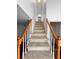 Stairs leading up to next level, wood banister and carpeted steps at 3260 Henderson Mill Rd # A, Atlanta, GA 30341