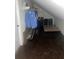 Attic storage with dark floors, sloped ceilings, and storage racks at 3260 Henderson Mill Rd # A, Atlanta, GA 30341