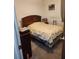 Bedroom featuring a bed with wooden headboard and carpeted floor at 3846 Narron Sw Dr, Atlanta, GA 30331