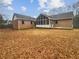 Large backyard with deck, screened-in porch, and plenty of space for outdoor activities at 180 Antebellum Way, Fayetteville, GA 30215
