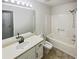 Bathroom featuring white sink, white bathtub, and tile floors at 180 Antebellum Way, Fayetteville, GA 30215