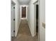 Hallway featuring neutral carpet and neutral paint at 180 Antebellum Way, Fayetteville, GA 30215