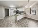 Modern kitchen with granite countertops, stainless steel appliances, and ample cabinet space at 180 Antebellum Way, Fayetteville, GA 30215