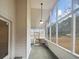 Relaxing screened porch with a swing, ceiling fan, and great natural light to enjoy outdoor living at 180 Antebellum Way, Fayetteville, GA 30215