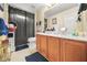 Bathroom featuring wood cabinets, a spacious vanity, and neutral decor at 854 Malvern Blvd, Stone Mountain, GA 30087