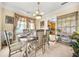 Formal dining area with an ornate table, chairs, and decorative display cabinet at 854 Malvern Blvd, Stone Mountain, GA 30087
