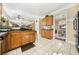 Well-lit kitchen with wood cabinets, tile floors, and an open layout at 854 Malvern Blvd, Stone Mountain, GA 30087