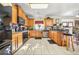 Kitchen featuring wood cabinets, tiled floor, and modern appliances at 854 Malvern Blvd, Stone Mountain, GA 30087