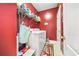 Well-organized laundry room with washer, dryer, shelving, and charming decor, making laundry day a breeze at 854 Malvern Blvd, Stone Mountain, GA 30087