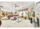 Open-concept living room boasts a cozy seating area, fireplace, and seamless connection to the kitchen at 854 Malvern Blvd, Stone Mountain, GA 30087