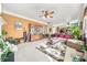 Spacious living room showcasing a large seating arrangement, a decorative rug, and a ceiling fan at 854 Malvern Blvd, Stone Mountain, GA 30087