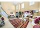 Open living room featuring large windows, a staircase, and a two-story ceiling at 854 Malvern Blvd, Stone Mountain, GA 30087