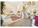 Bright living room with a staircase, hardwood floors, and large windows with views at 854 Malvern Blvd, Stone Mountain, GA 30087