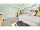 Light-filled main bedroom featuring carpeted floors, neutral trim, and calming green walls at 854 Malvern Blvd, Stone Mountain, GA 30087
