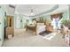 Tranquil main bedroom features trey ceilings, neutral carpet and trim, and calming green walls at 854 Malvern Blvd, Stone Mountain, GA 30087