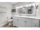 A white bathroom vanity with a marble countertop and double sinks at 1160 Windsor Pkwy # 13, Atlanta, GA 30319