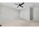 A carpeted bedroom featuring a ceiling fan and a double door closet at 1160 Windsor Pkwy # 13, Atlanta, GA 30319