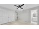 A carpeted bedroom with a ceiling fan, closet, and access to the bathroom at 1160 Windsor Pkwy # 13, Atlanta, GA 30319