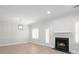 Cozy living room features wood floors, a fireplace, and natural light, creating a warm atmosphere at 1160 Windsor Pkwy # 13, Atlanta, GA 30319