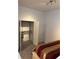 View of bedroom with organized closet space and neutral walls at 361 17Th Nw St # 2308, Atlanta, GA 30363