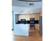 Modern kitchen features stainless steel appliances and sleek black backsplash at 361 17Th Nw St # 2308, Atlanta, GA 30363