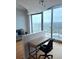 Living room featuring a desk area, large window and city views at 361 17Th Nw St # 2308, Atlanta, GA 30363