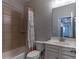 Bathroom with shower-tub combo, patterned shower curtain, and vanity sink at 600 Lockerbie Ter, Mcdonough, GA 30252