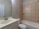 Bright bathroom showcasing a shower-tub, vanity sink and large mirror at 600 Lockerbie Ter, Mcdonough, GA 30252
