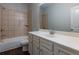 Bathroom featuring a shower-tub, large mirror, and a vanity sink at 600 Lockerbie Ter, Mcdonough, GA 30252