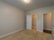 This bedroom features a walk in closet and modern lighting at 600 Lockerbie Ter, Mcdonough, GA 30252