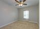 Cozy bedroom with a ceiling fan and a window with blinds allowing for natural light at 600 Lockerbie Ter, Mcdonough, GA 30252