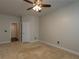 Bedroom with carpeted floor, fan, and natural light at 600 Lockerbie Ter, Mcdonough, GA 30252