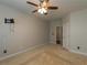 Bedroom featuring carpeted floors, a ceiling fan and a mounted TV at 600 Lockerbie Ter, Mcdonough, GA 30252