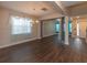 Open dining room featuring hardwood floors, chandelier, and neutral walls at 600 Lockerbie Ter, Mcdonough, GA 30252