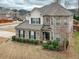 Charming two-story brick home with a turret, well-kept lawn and professional landscaping at 600 Lockerbie Ter, Mcdonough, GA 30252