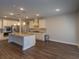 Bright kitchen boasts stainless appliances, kitchen island and granite countertops at 600 Lockerbie Ter, Mcdonough, GA 30252