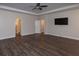 Spacious living room with modern flooring, ceiling fan, tray ceiling and recessed lighting at 600 Lockerbie Ter, Mcdonough, GA 30252