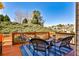 Inviting back deck with wicker furniture, a blue rug and landscaping views at 1137 Maple Creek Rdg, Loganville, GA 30052