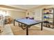Spacious finished basement featuring a ping pong table and functional layout at 1137 Maple Creek Rdg, Loganville, GA 30052