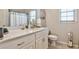Bright bathroom with a white vanity, modern fixtures and neutral décor at 1137 Maple Creek Rdg, Loganville, GA 30052